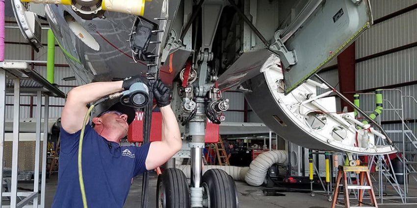 Mechanic working on a plane