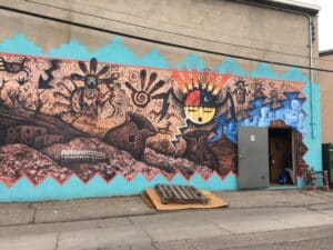 mural by Tommy A. Singer located behind the Totah Theater