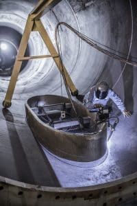 Man welding wind towers