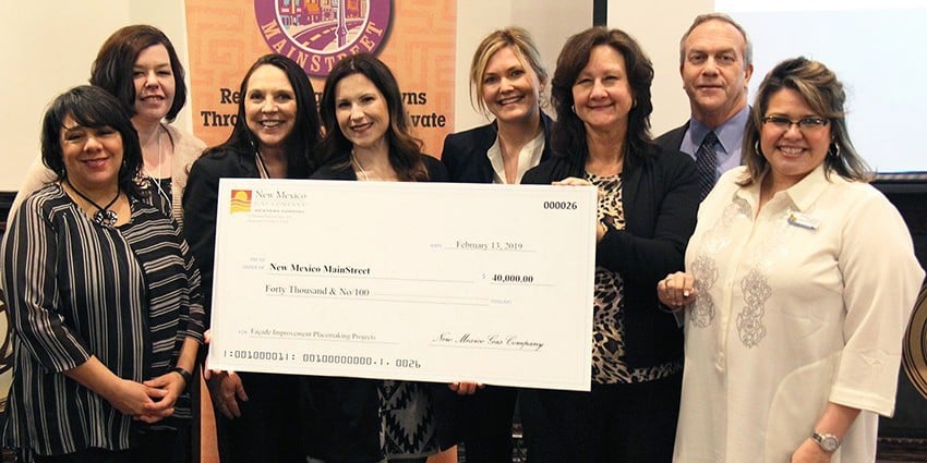 NM Gas Co and NM Mainstreet staff photo with a check