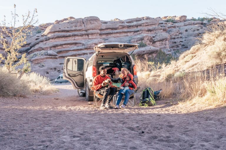a couple relaxing in the back of an RV