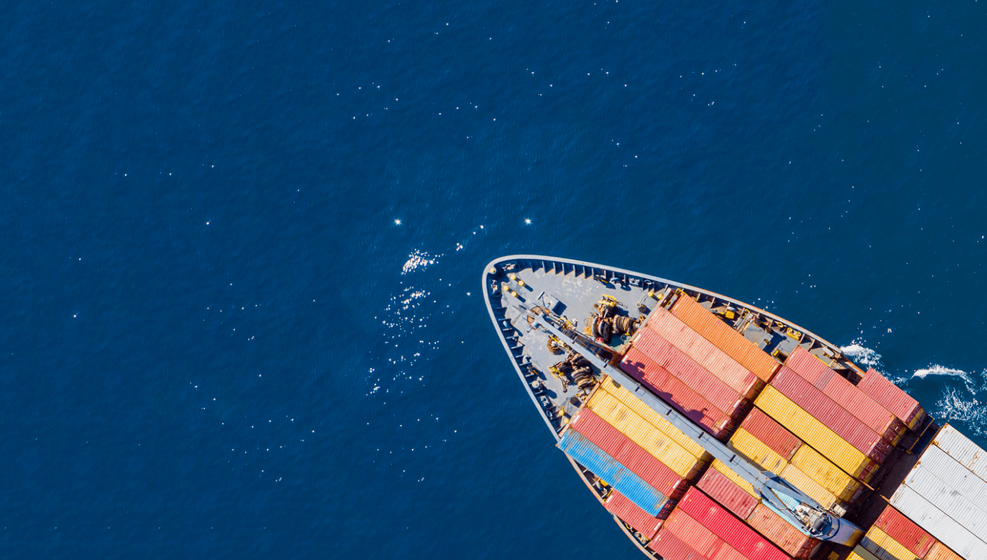 Cargo ship at sea with cargo containers on the ship