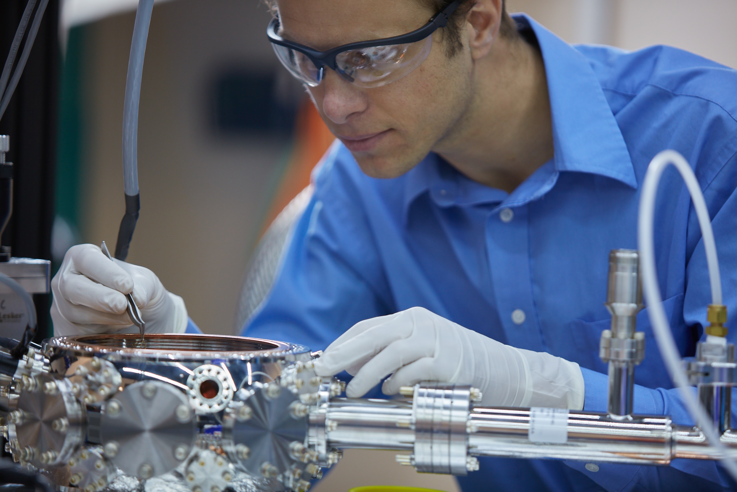 Scientist working on a mechanical part